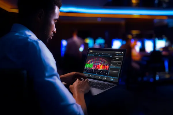 A close-up shot of golden coins falling around a spinning roulette wheel, representing immersive casino action at 777ZK.