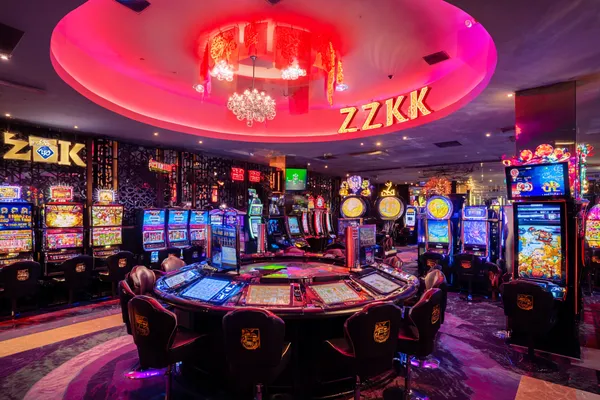 A woman in a luxurious green gown next to an ornate roulette wheel, capturing the upscale casino mood of 777ZK.